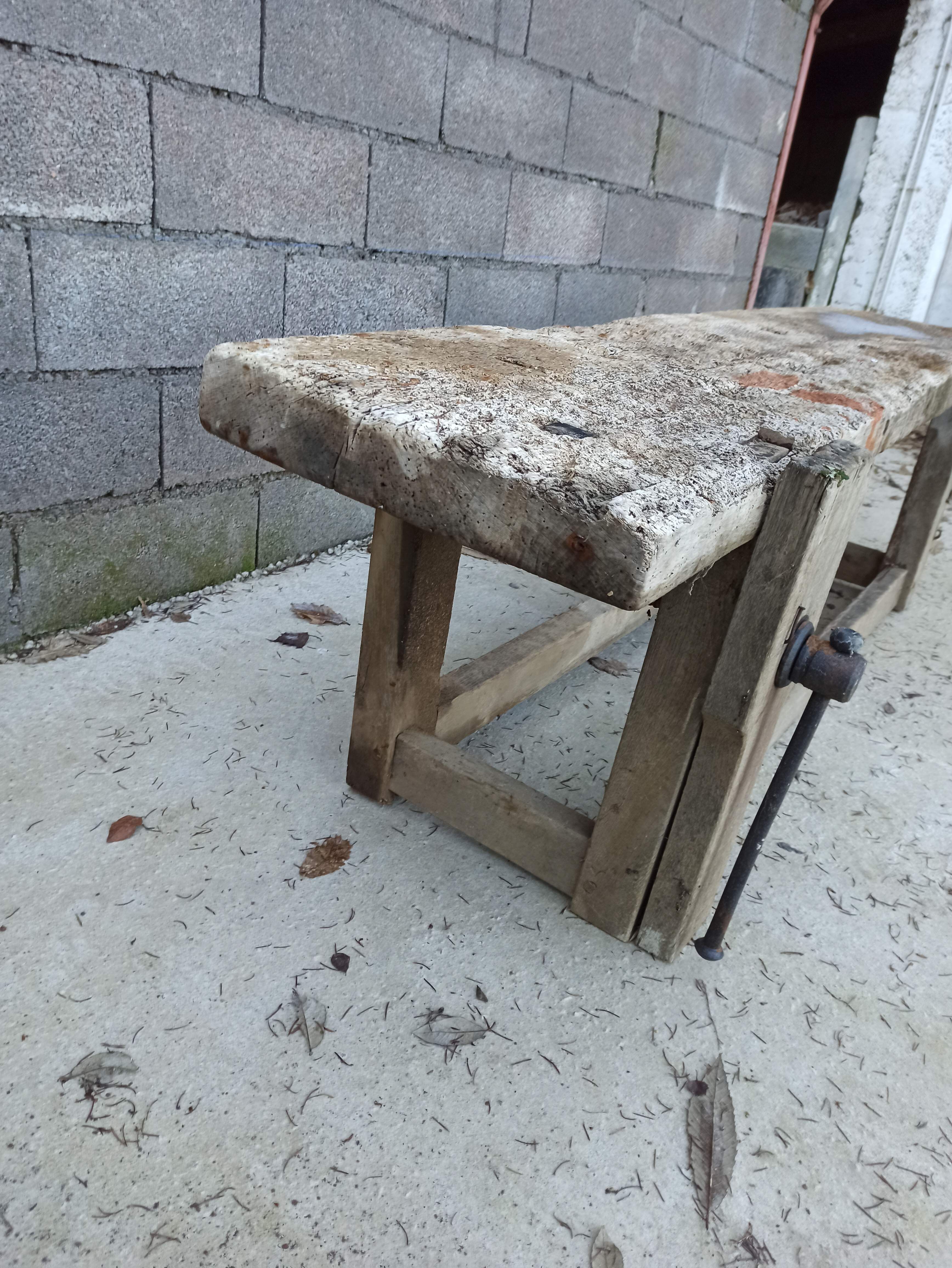 Wooden carpenter's workbench with iron and wooden vice