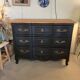 Black and wood chest of drawers