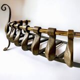 Old cast iron and brass log holder