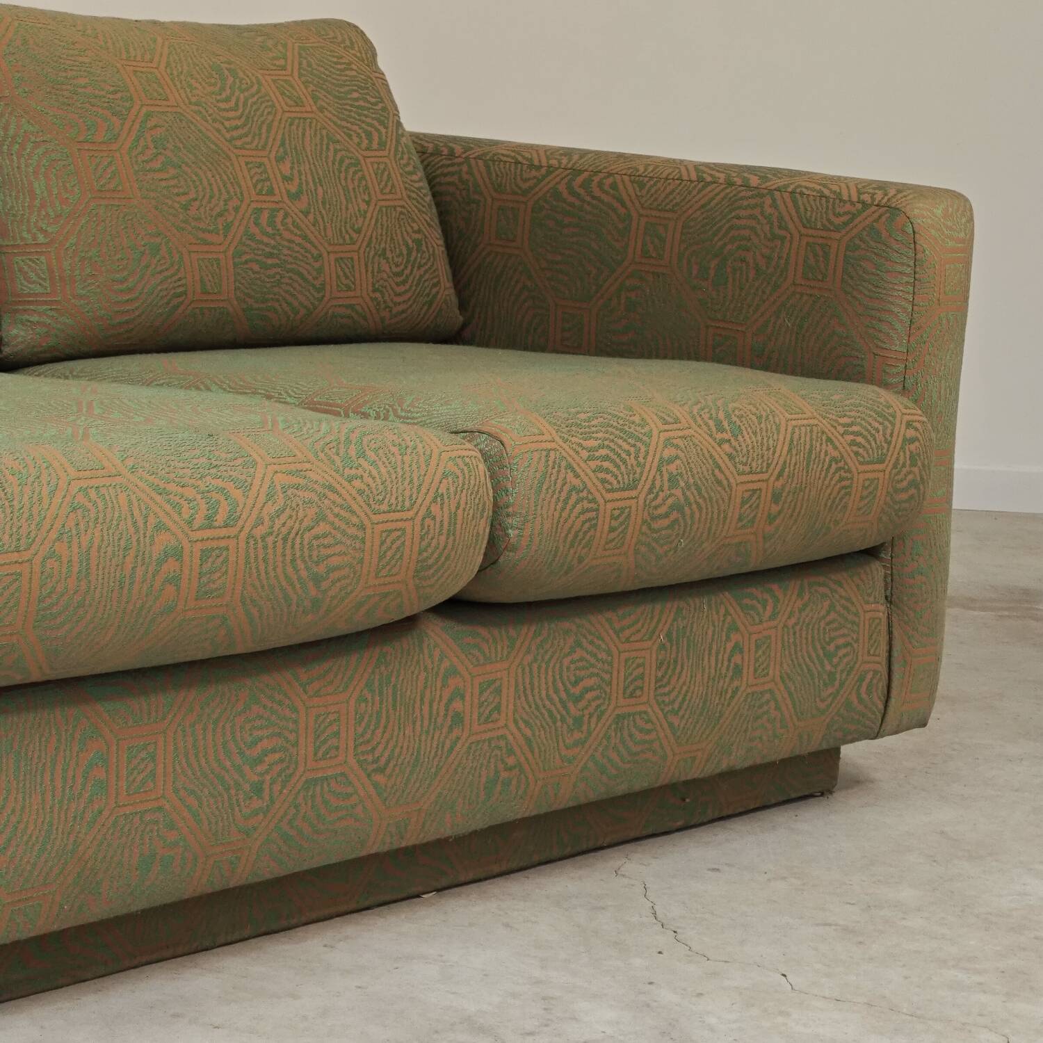 Pierre Frey modernist bench in green and gold patterned fabric