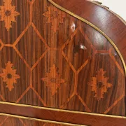 Louis XV cylinder desk with floral marquetry and gilded ornaments.