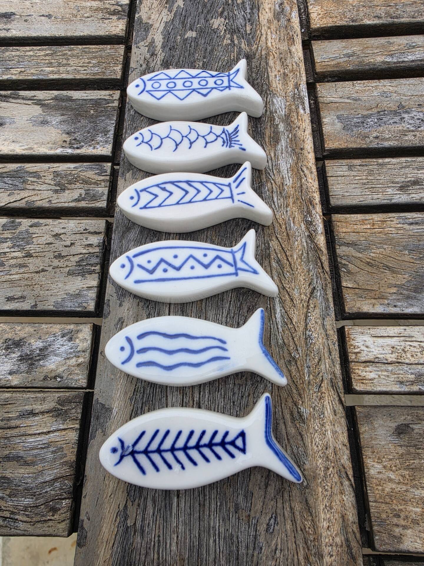 Set of 6 vintage ceramic painted fish motif spoon rests.