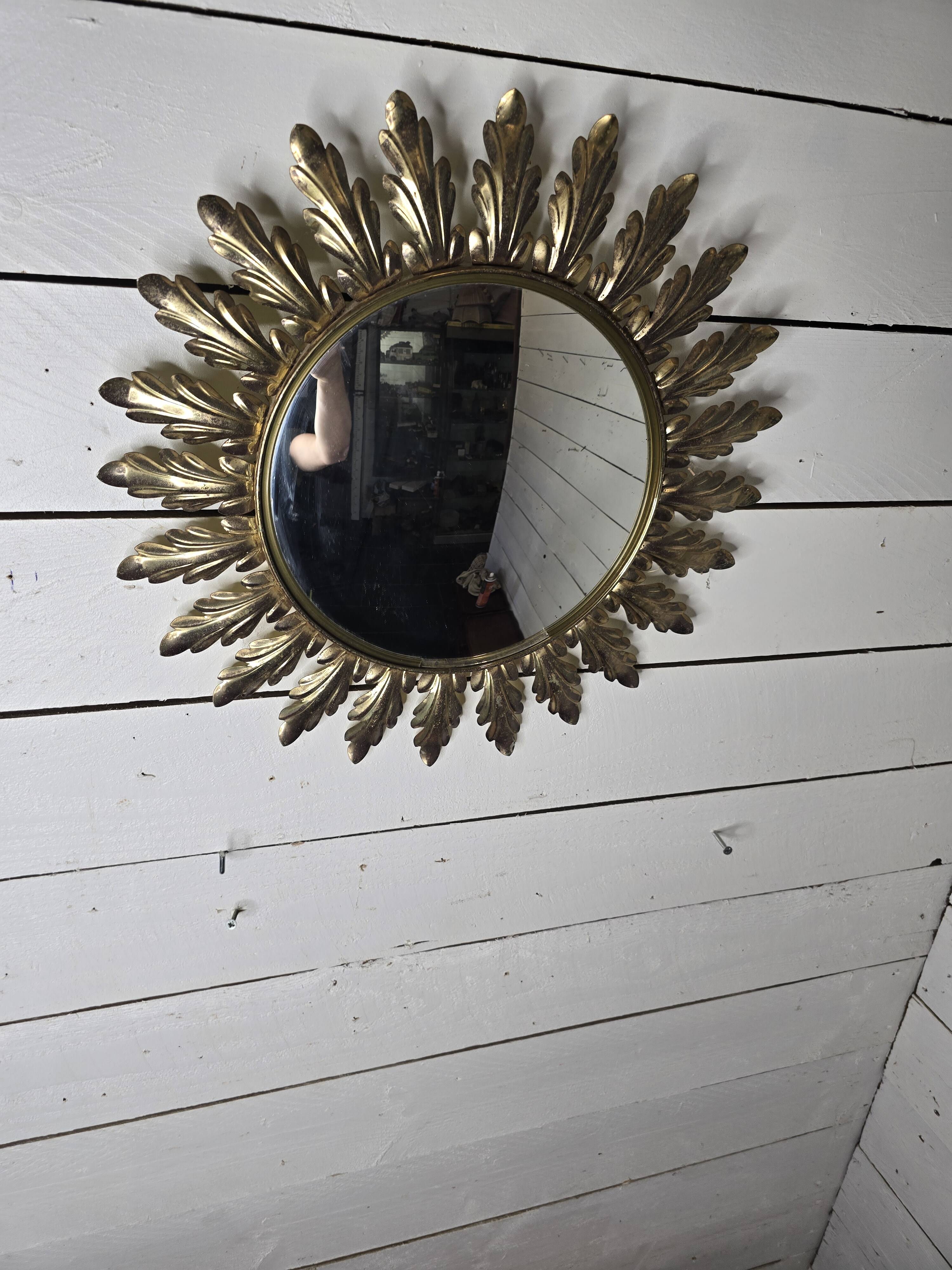 Witch's eye sun mirror in gold metal from the 60s