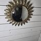 Witch's eye sun mirror in gold metal from the 60s