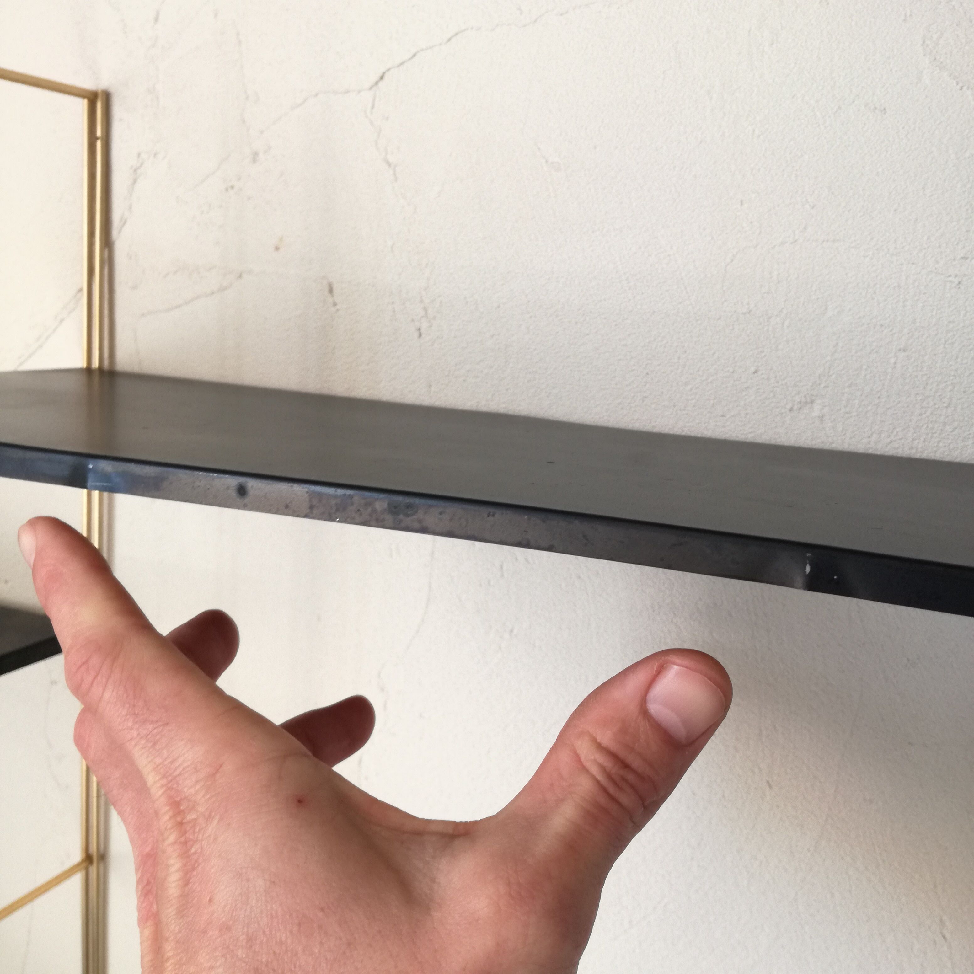 Gold and black thong shelf