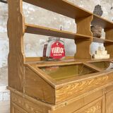 Wooden hardware cabinet painted with wood effect, circa 1940.