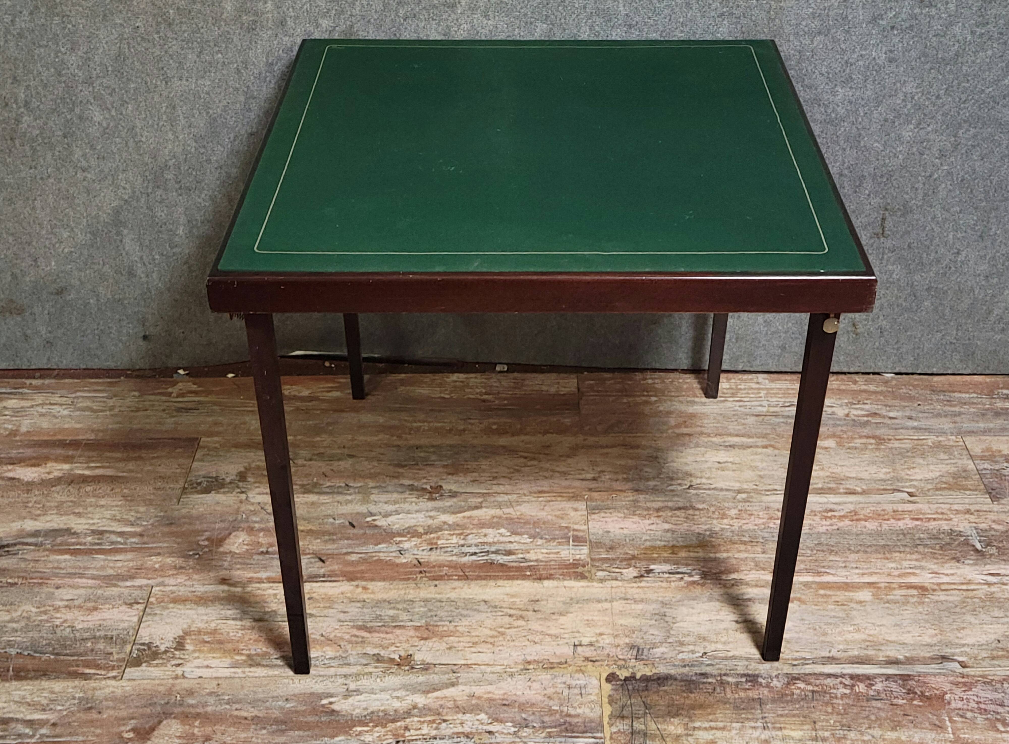 a wooden Bridge game table resting on four thin, straight legs