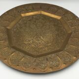 Oriental brass tray with chiseled decoration of arabesques and flowers