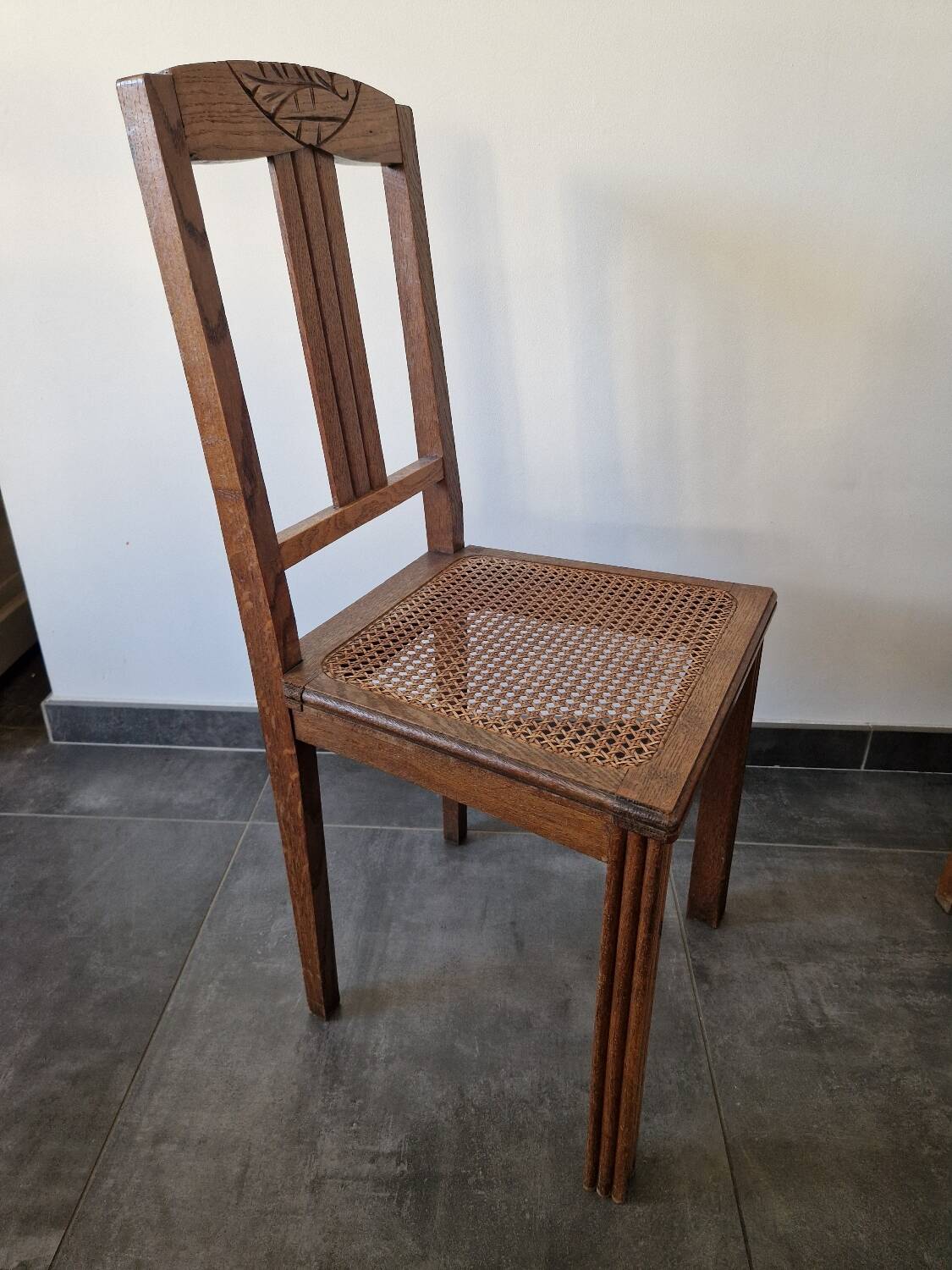 Wooden and cane chair. Carved wooden chair with cane seat.
