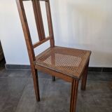 Wooden and cane chair. Carved wooden chair with cane seat.