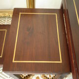 Pull-out tables in mahogany and vintage brass