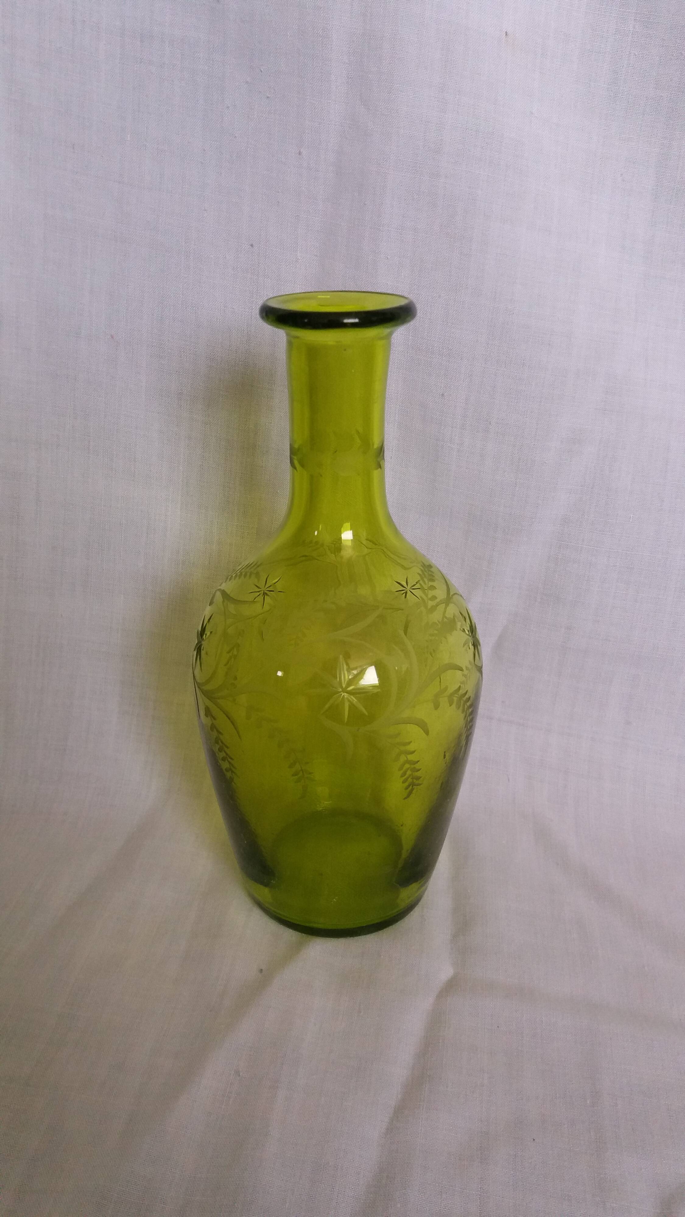 Cut and engraved green blown glass carafe vase