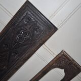Set of 2 carved brown wooden panels, rural Hungary, 1940s, geometric patterns.