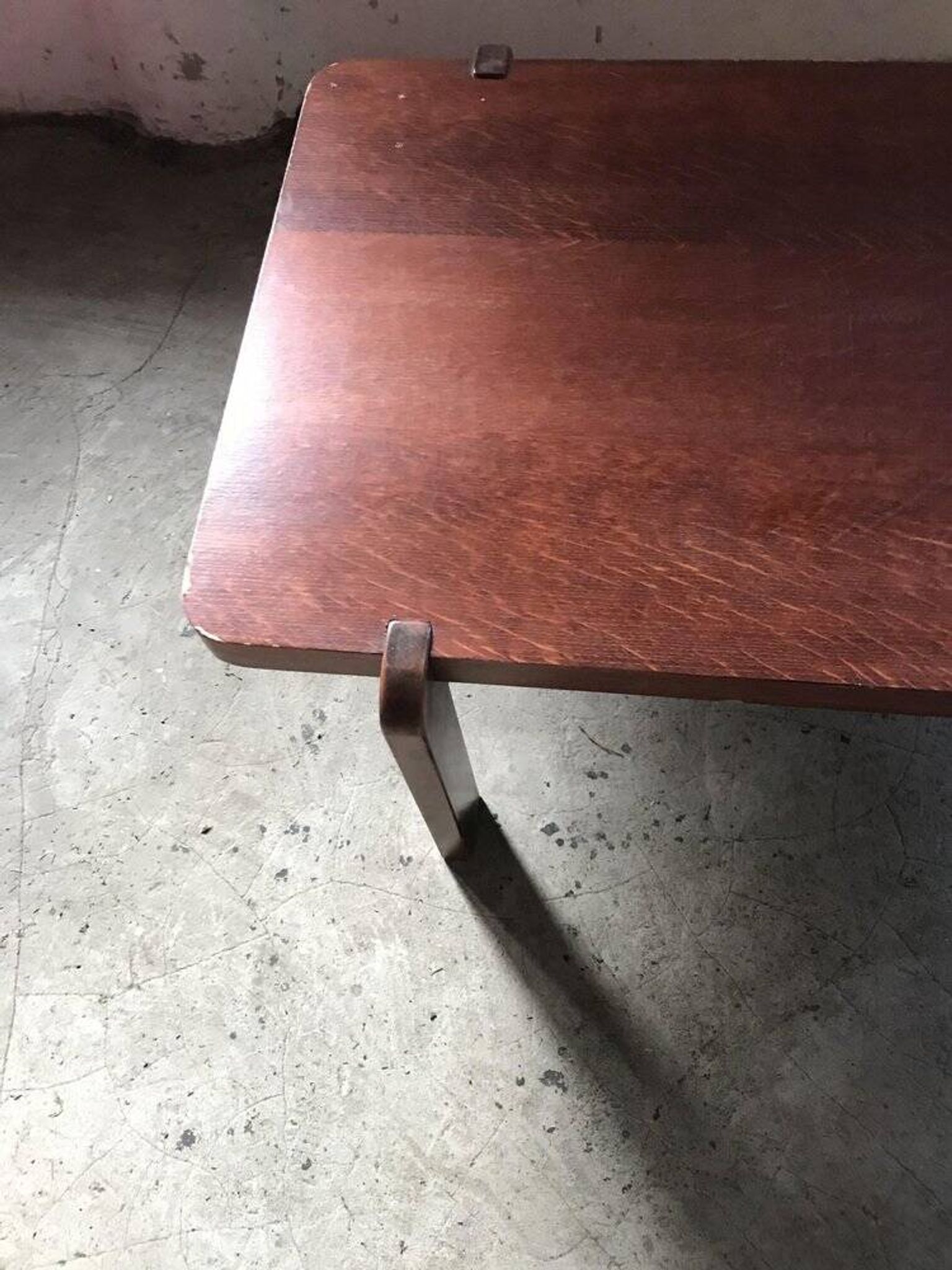 Mid-century coffee table in brown wood from the 1970s, rectangular top with rounded corners.