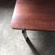 Mid-century coffee table in brown wood from the 1970s, rectangular top with rounded corners.