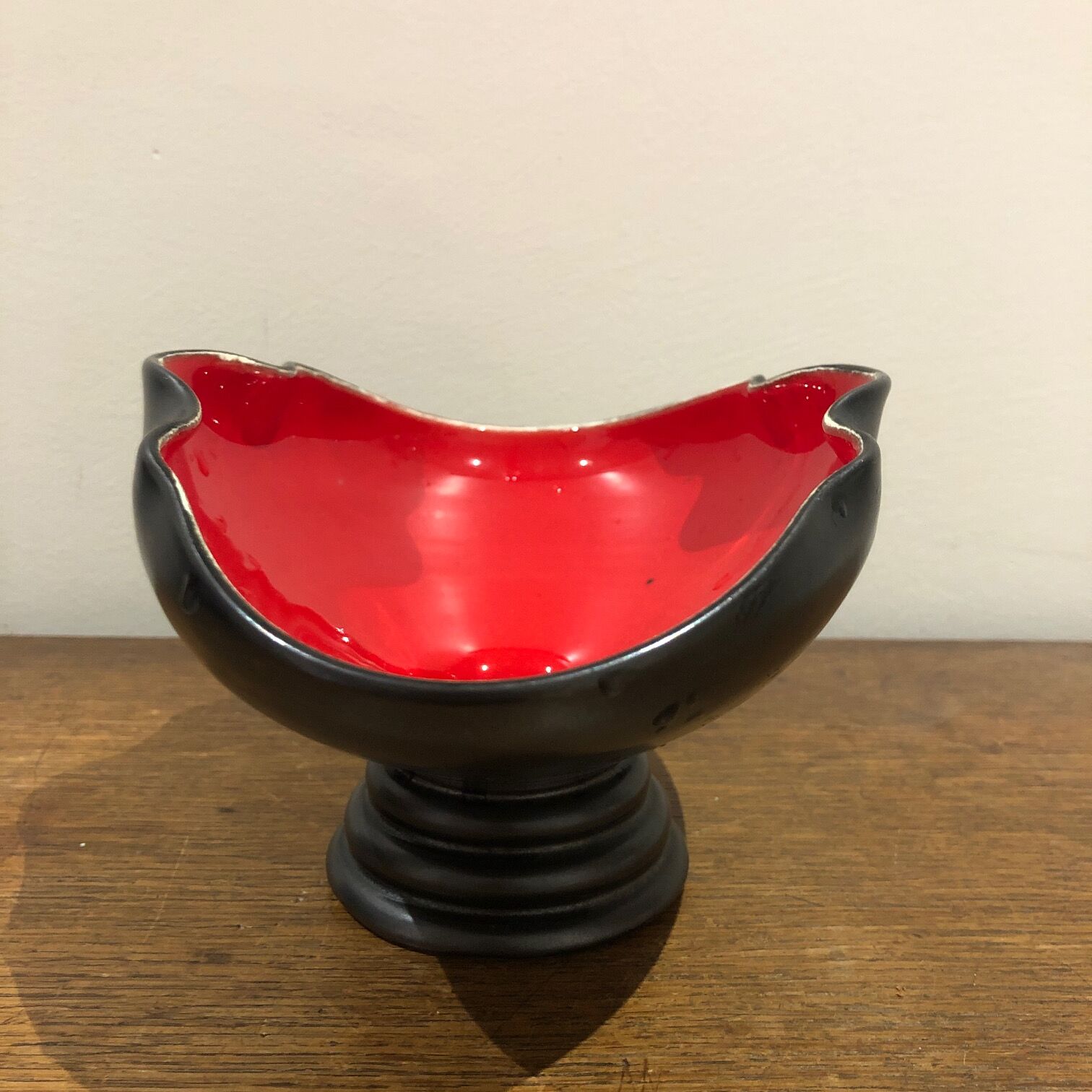 Red and black trinket bowl of the 50s