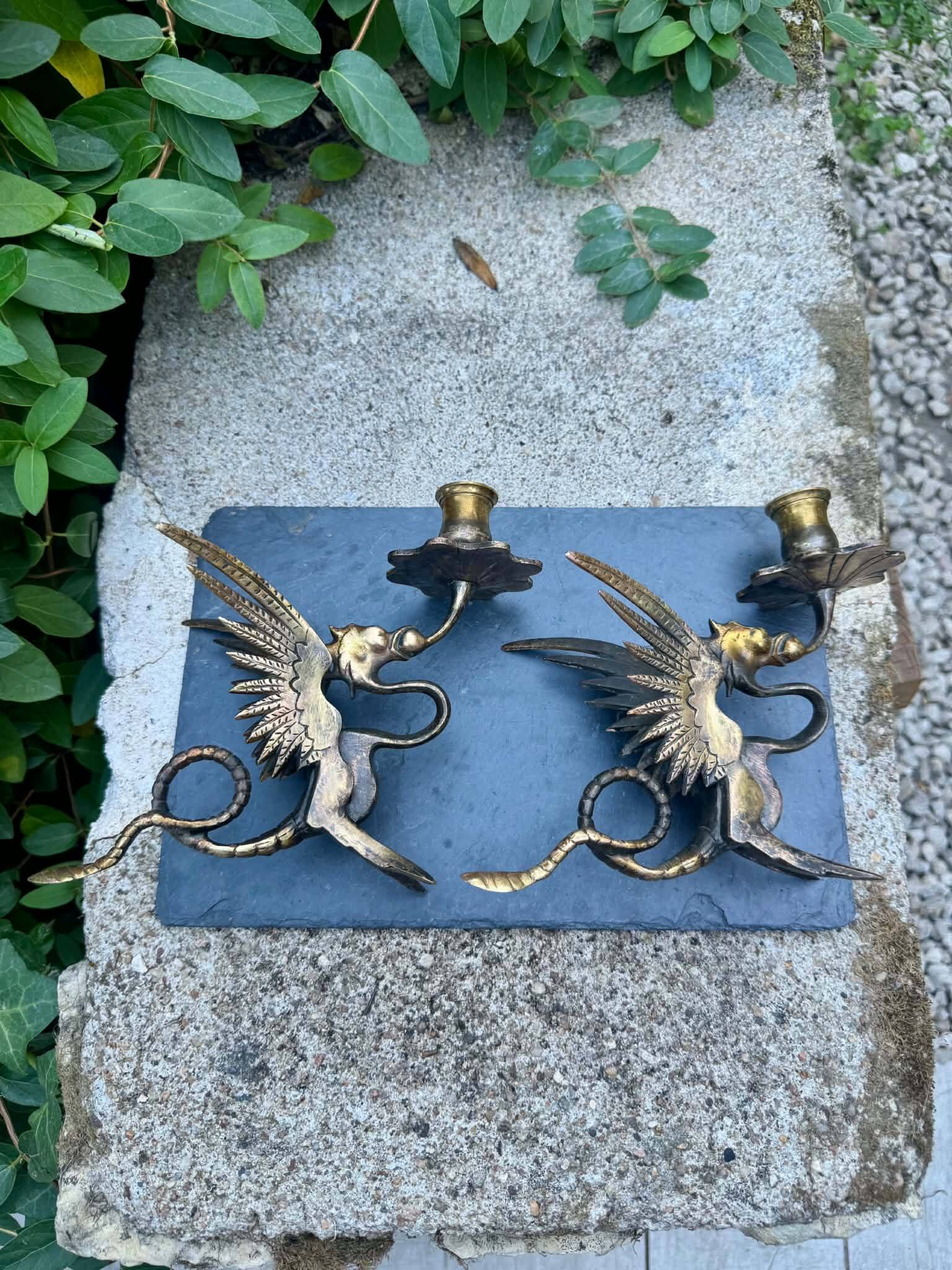 Pair of chimera candle holders in bronze, 19th century.