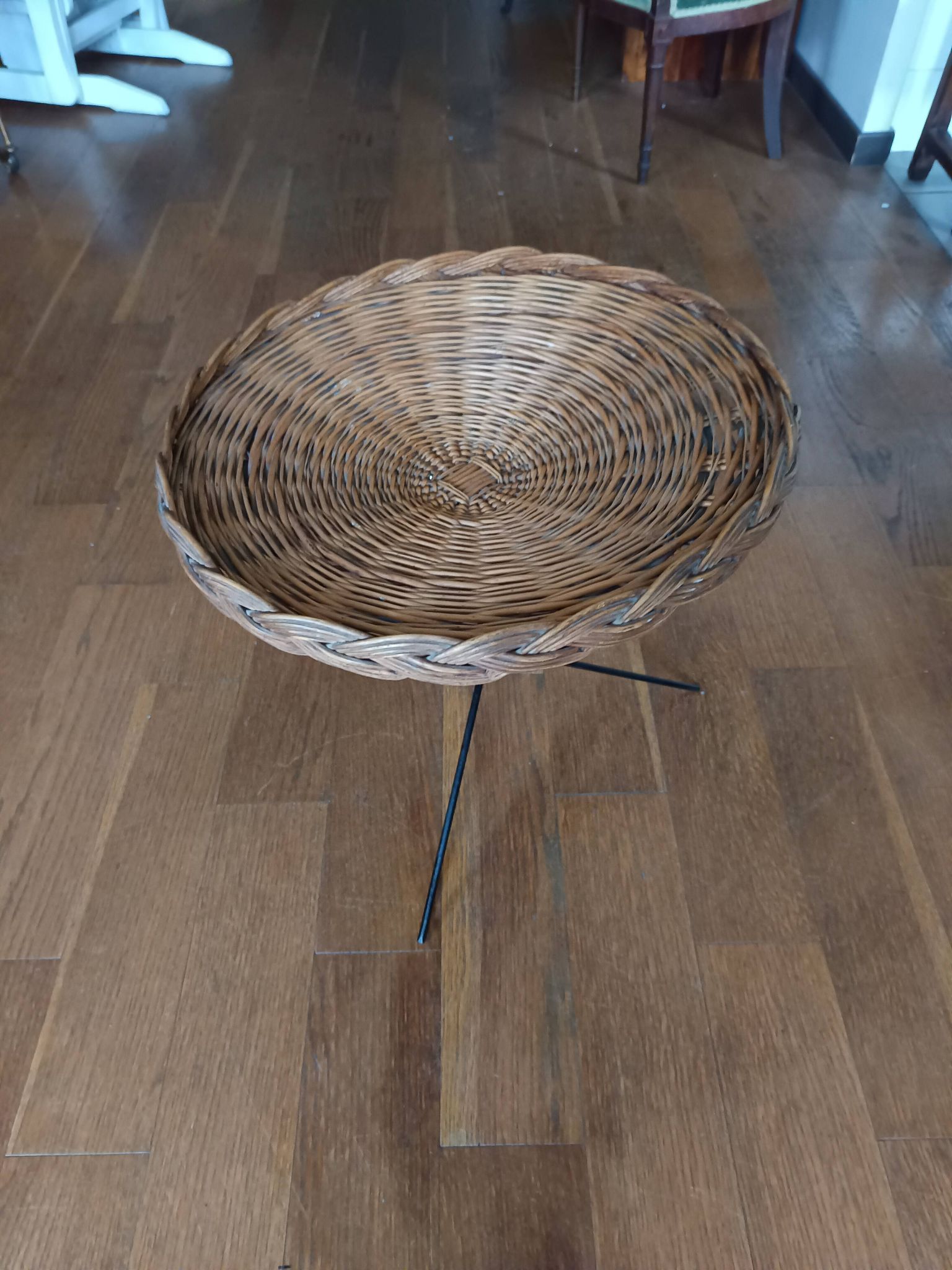 vintage wicker gueridon with a black metal tripod base from the 1960s