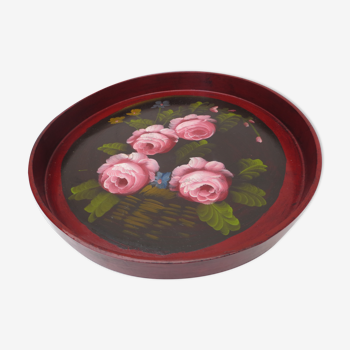 Old round wooden top painted with roses