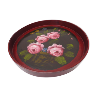 Old round wooden top painted with roses