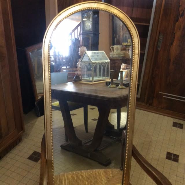 Wooden mirror and gilded stucco