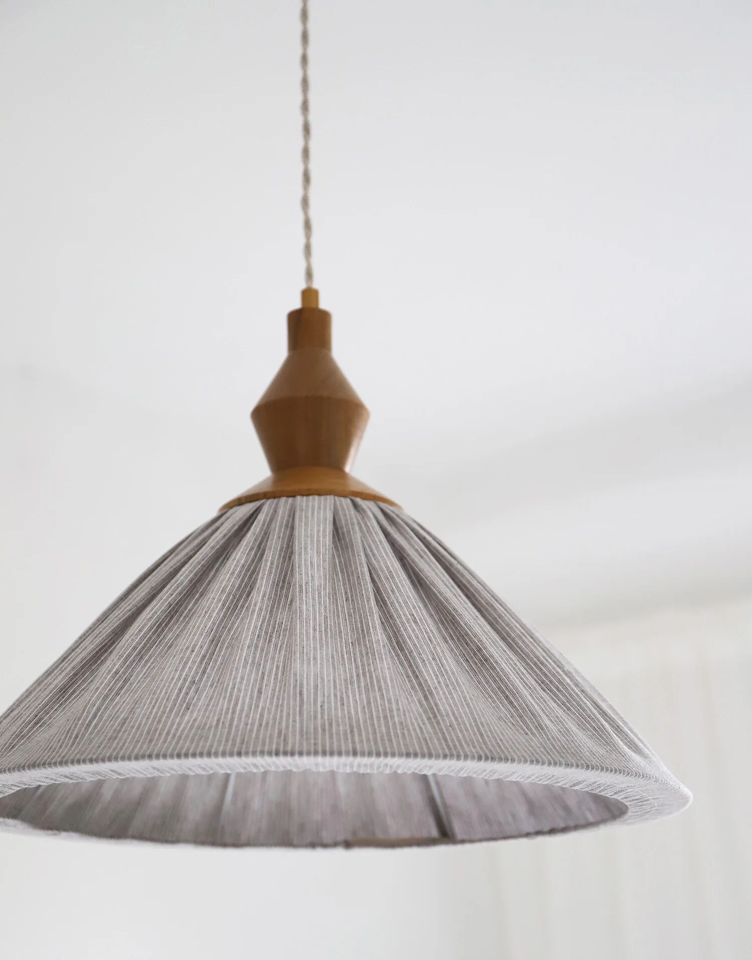 Pleated curtain Olga in linen and cotton with fine classic grey stripes.