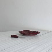 Red ceramic butter dish with knife