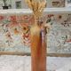 Old bottle in terracotta varnished finish