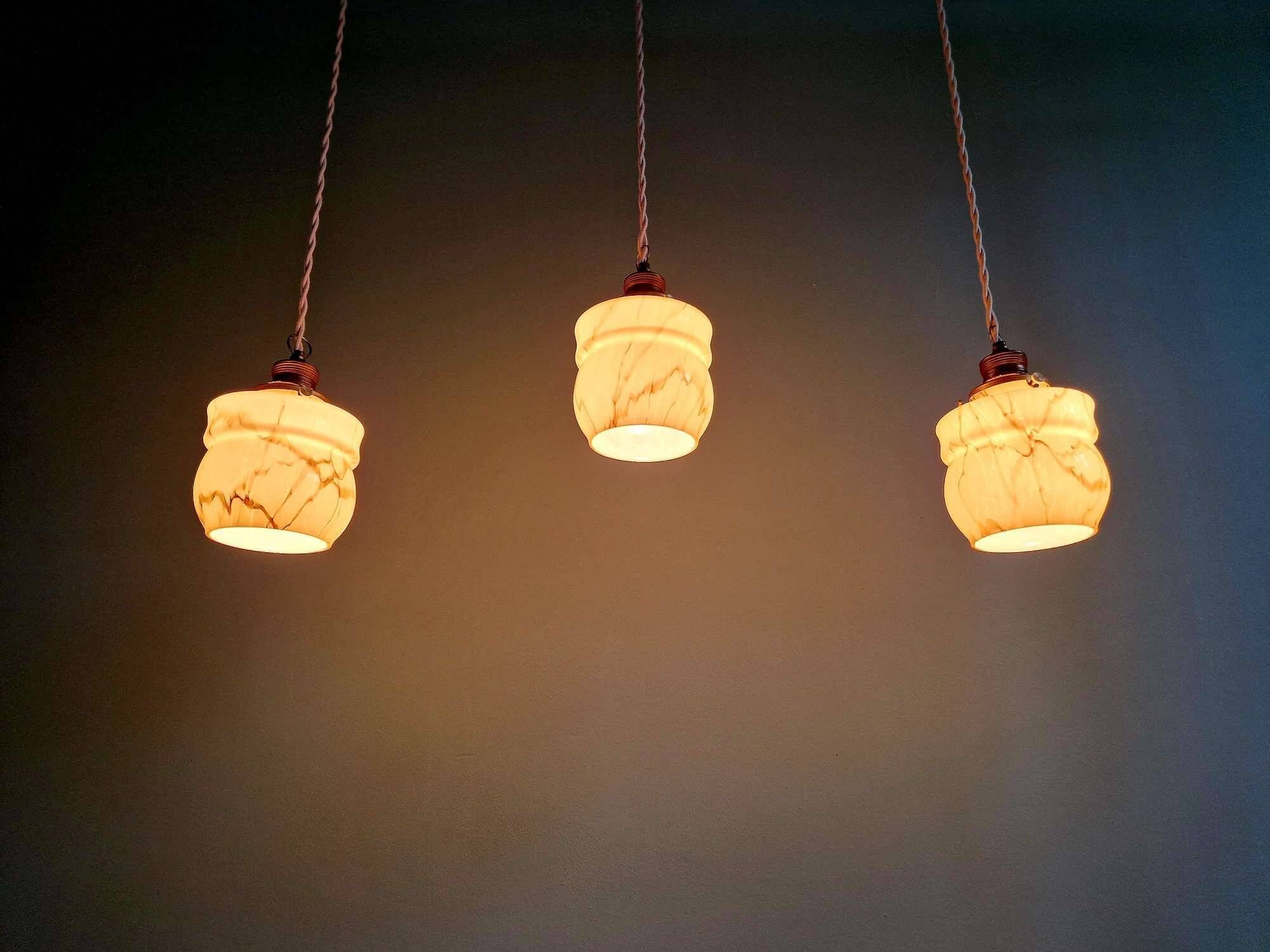 Art Deco trio of suspensions in opaline and marbled ouraline, Scailmont, 1920-30.