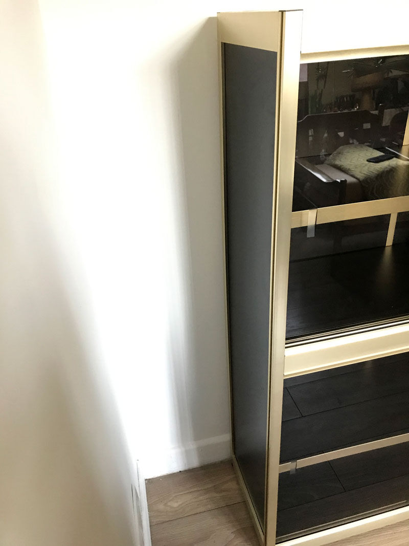 Shelves of black and gold windows