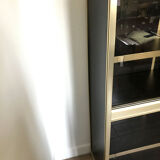 Shelves of black and gold windows