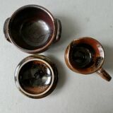 6 cups, 1 sugar bowl and 1 milk pot, made of sandstone by Isabelle Roger and Pierre Bernier