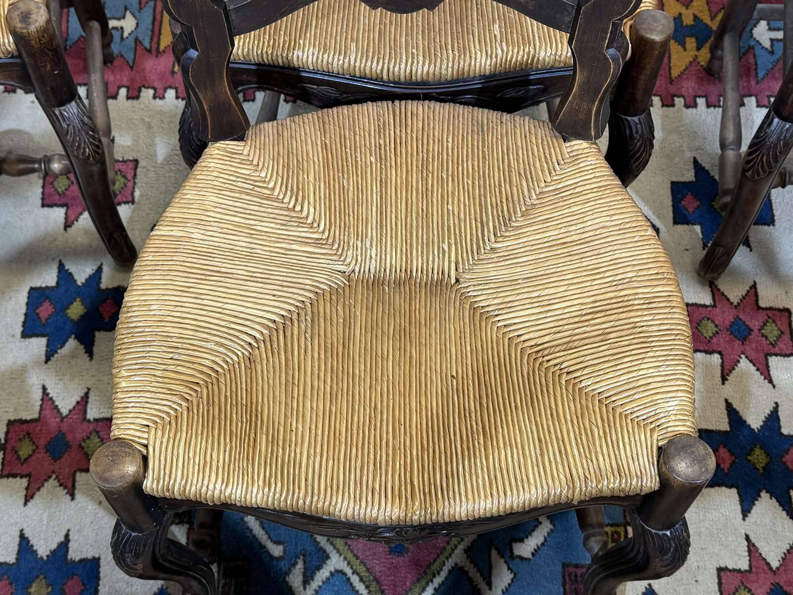 Set of 7 Louis XV style beech chairs with straw seats.