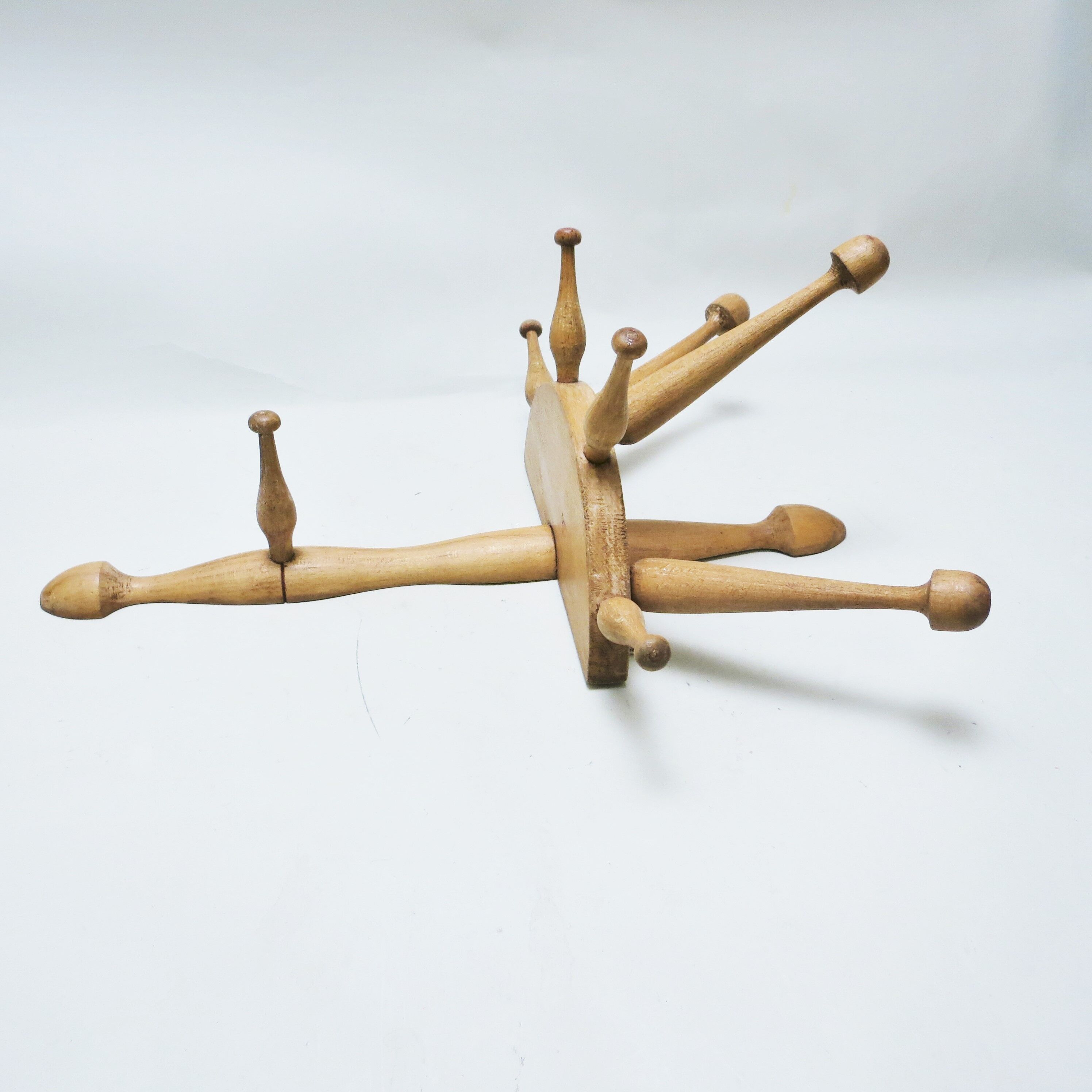 Turned wood wall coat rack