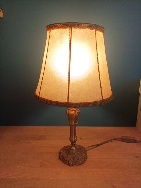 Living room lamp with golden bronze base and shade
