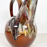 Large bird jug with high neck and handle, signed under the base