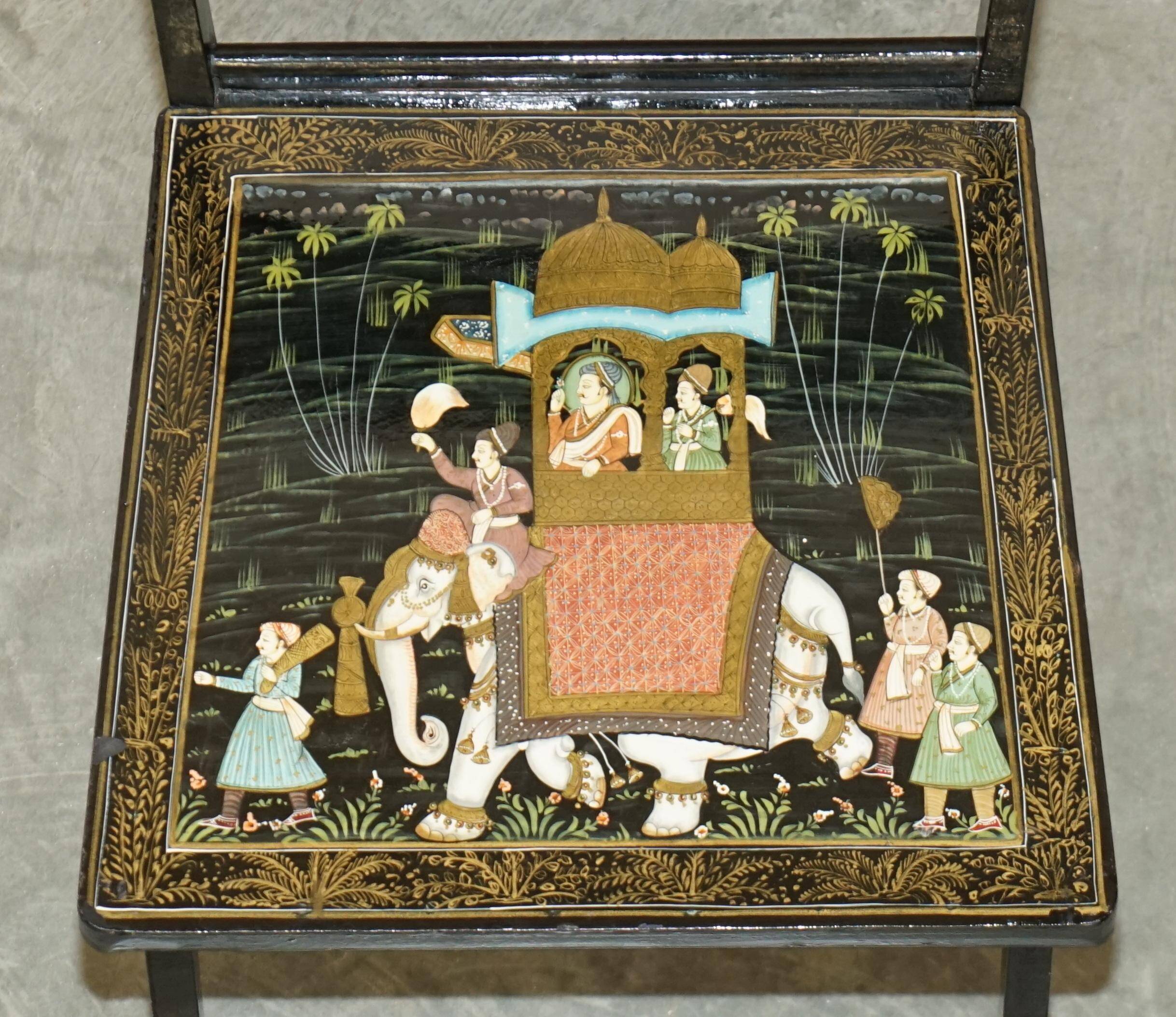 Pair of military folding chairs with Indian decoration.