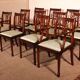 set of 10 chairs and two mahogany armchairs in Hepplewhite style