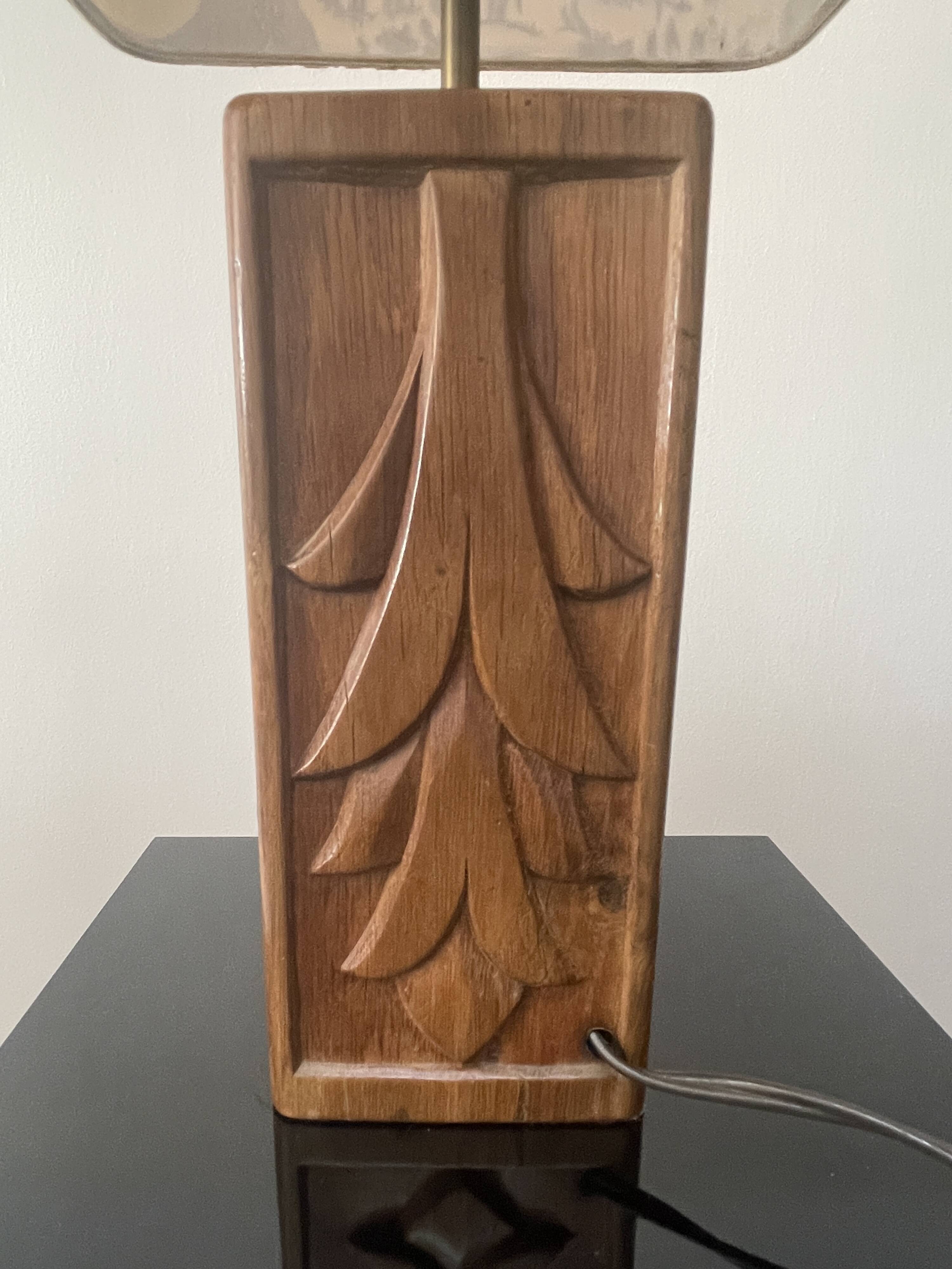 Wooden lamp with carved plant decoration from 1930-50, sold with a 1970 lampshade.