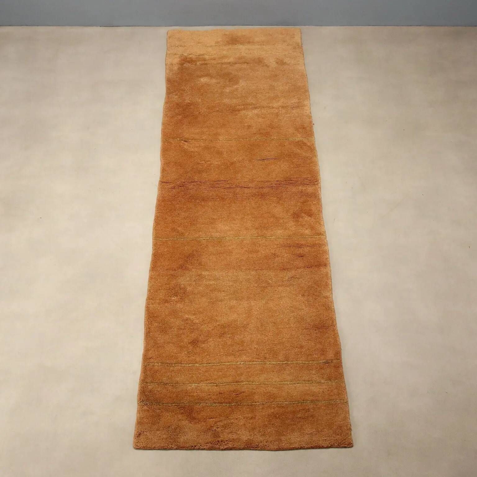 Ancient Asian wool rug, hand-knotted, 118 x 31 in.