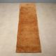 Ancient Asian wool rug, hand-knotted, 118 x 31 in.