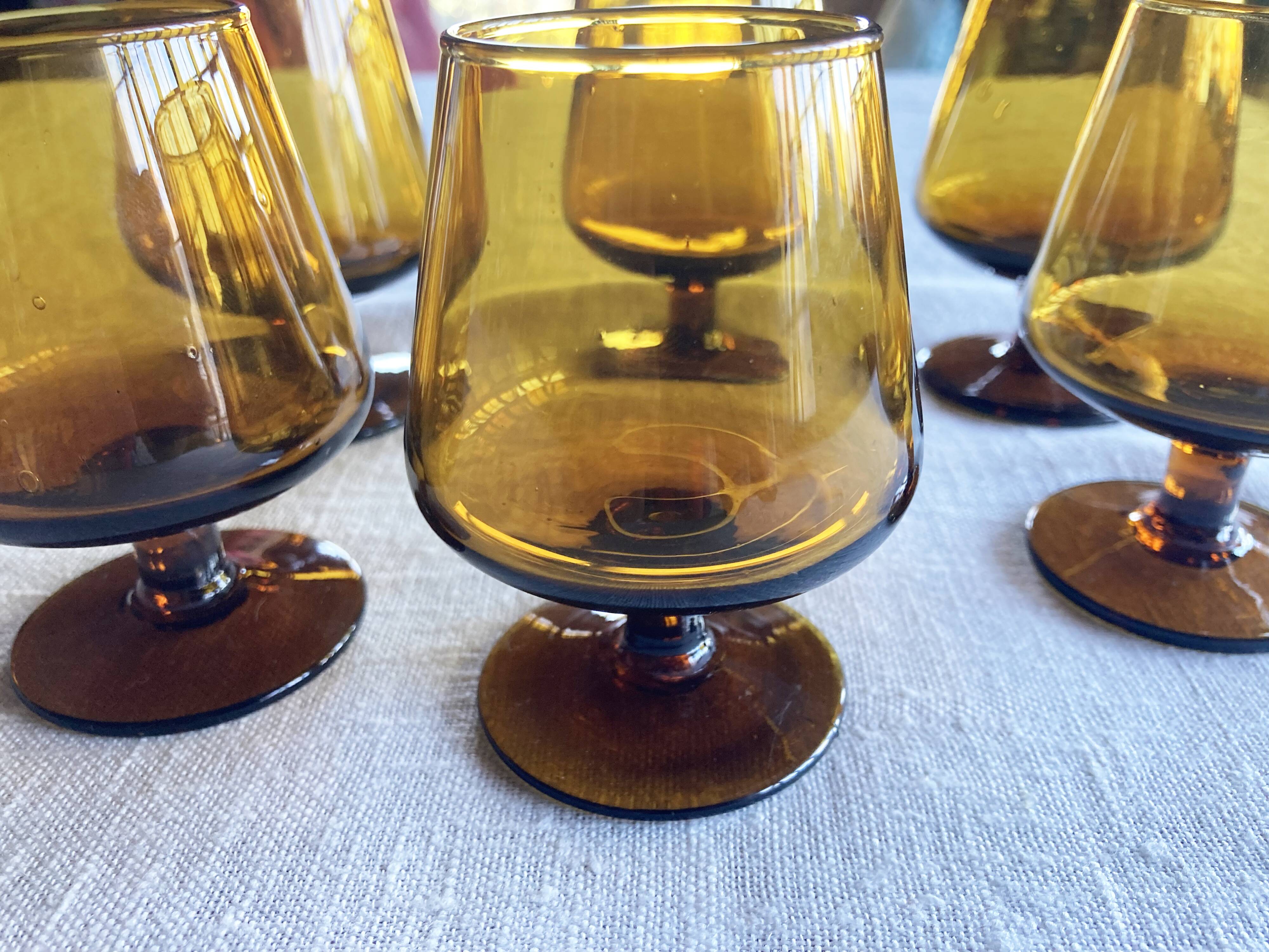 6 small amber glass stemmed glasses