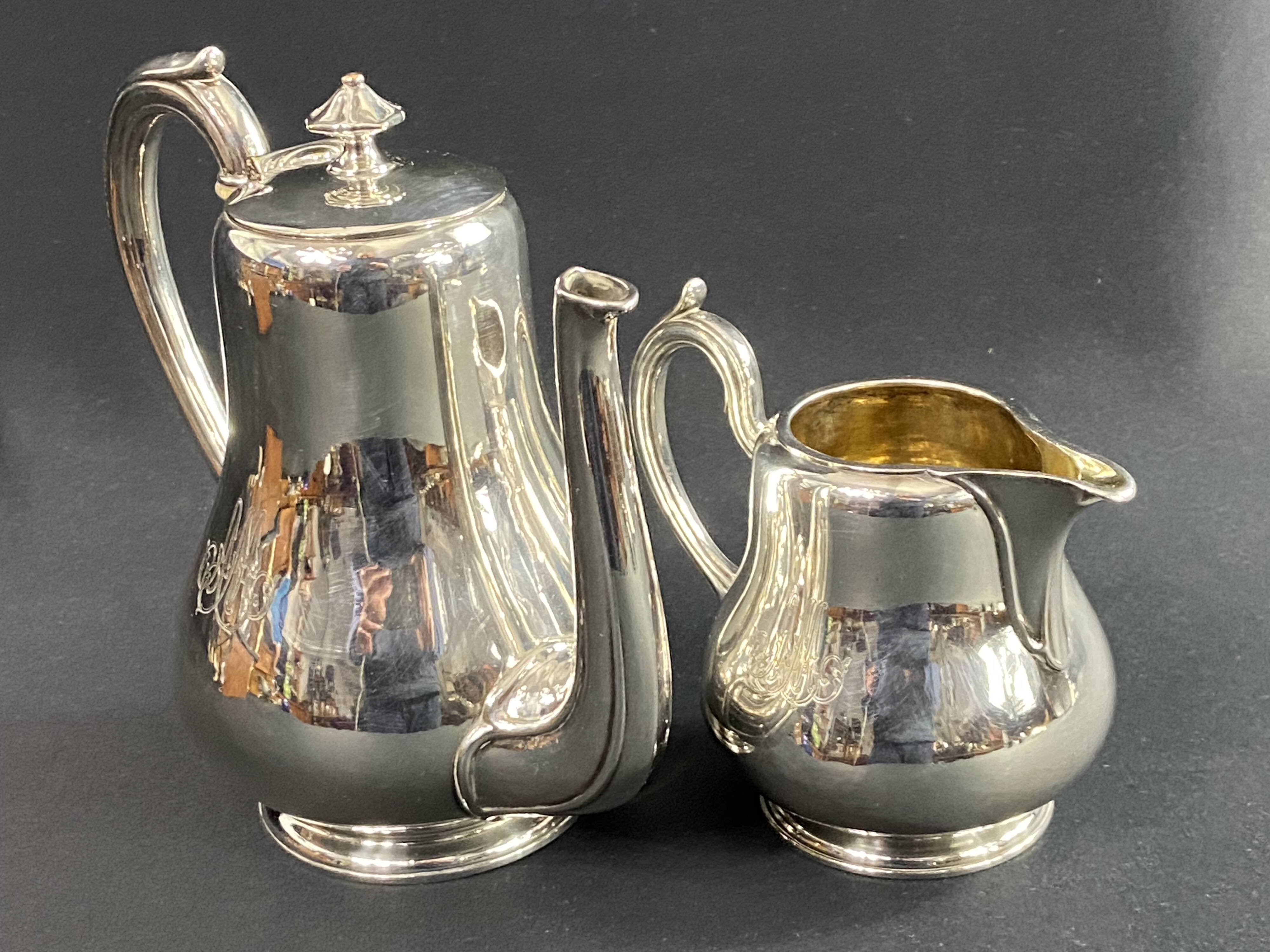 Silver-plated coffee pot and milk jug monogrammed MA, signed CHRISTOFLE.