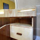 Bed with integrated bedside in rosewood and parchment, art deco period, twentieth century