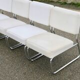 4 chauffeuses formant canapé modulable. acier, simili-cuir, années 70