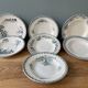 Set of 7 mismatched hollow plates Terre de Fer XIXth
