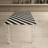 Iron table with top in black and white ceramic tiles