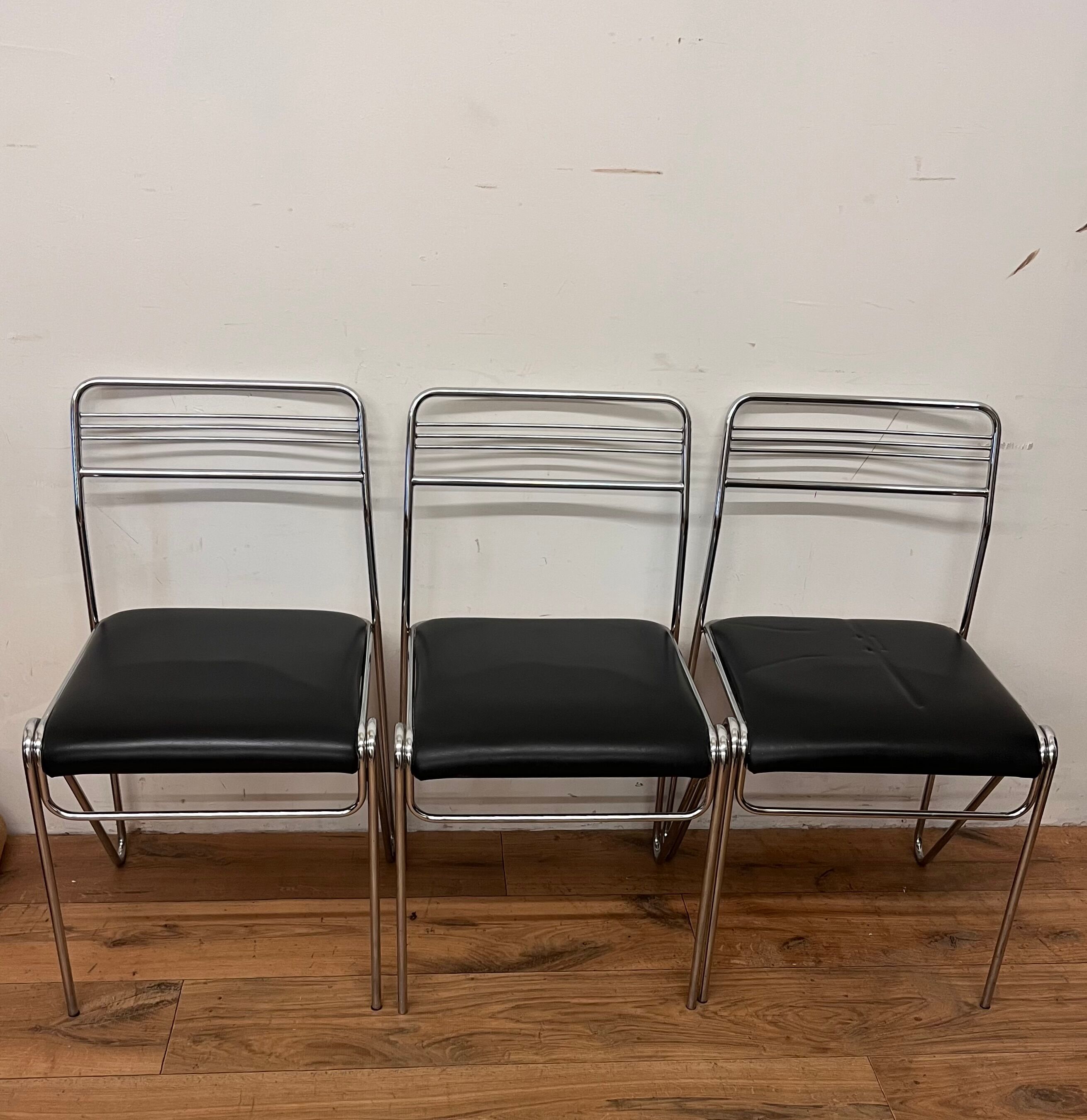 Three chrome and skai chairs from the 70s