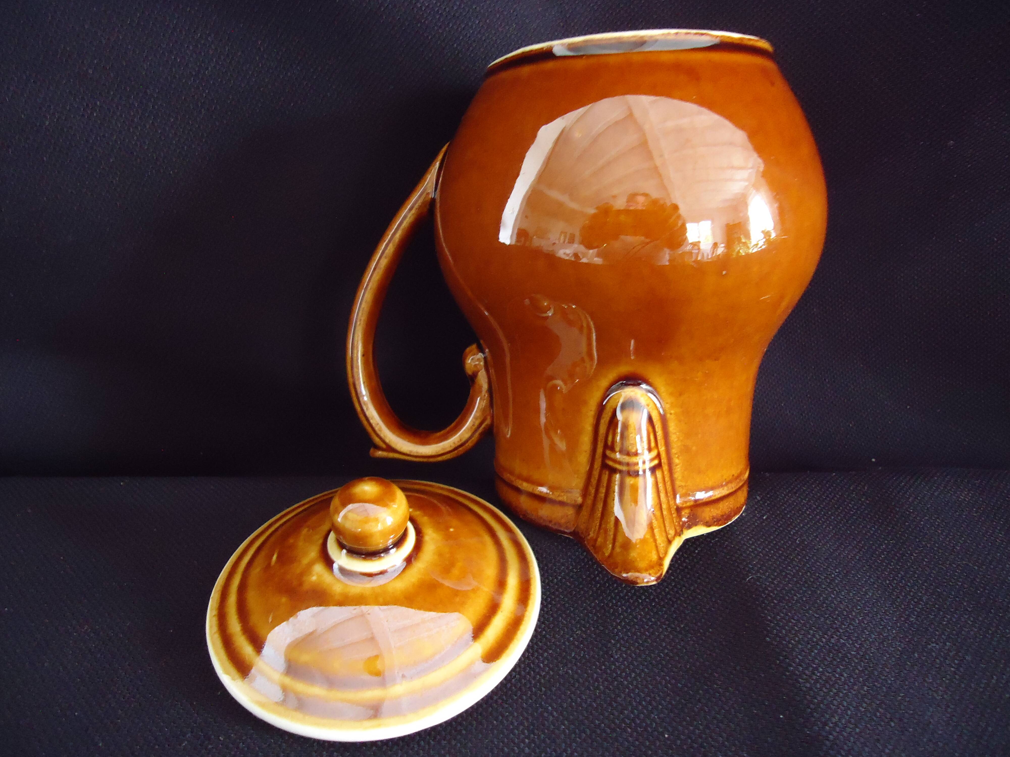 Old covered milk jug, side handle