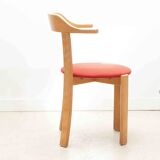 Chair upholstered in red and beech